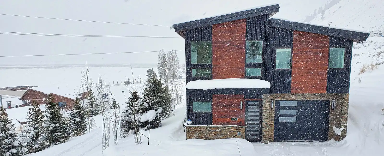The Main House on a snowy day at Elk Ridge Estate, a Jackson Hole luxury vacation rental.