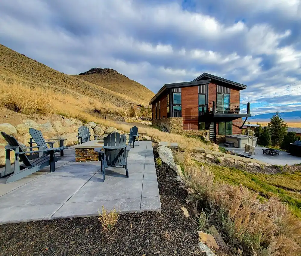 Main House outdoor patio with fire pit at Elk Ridge Estate, a Jackson Hole luxury home rental.